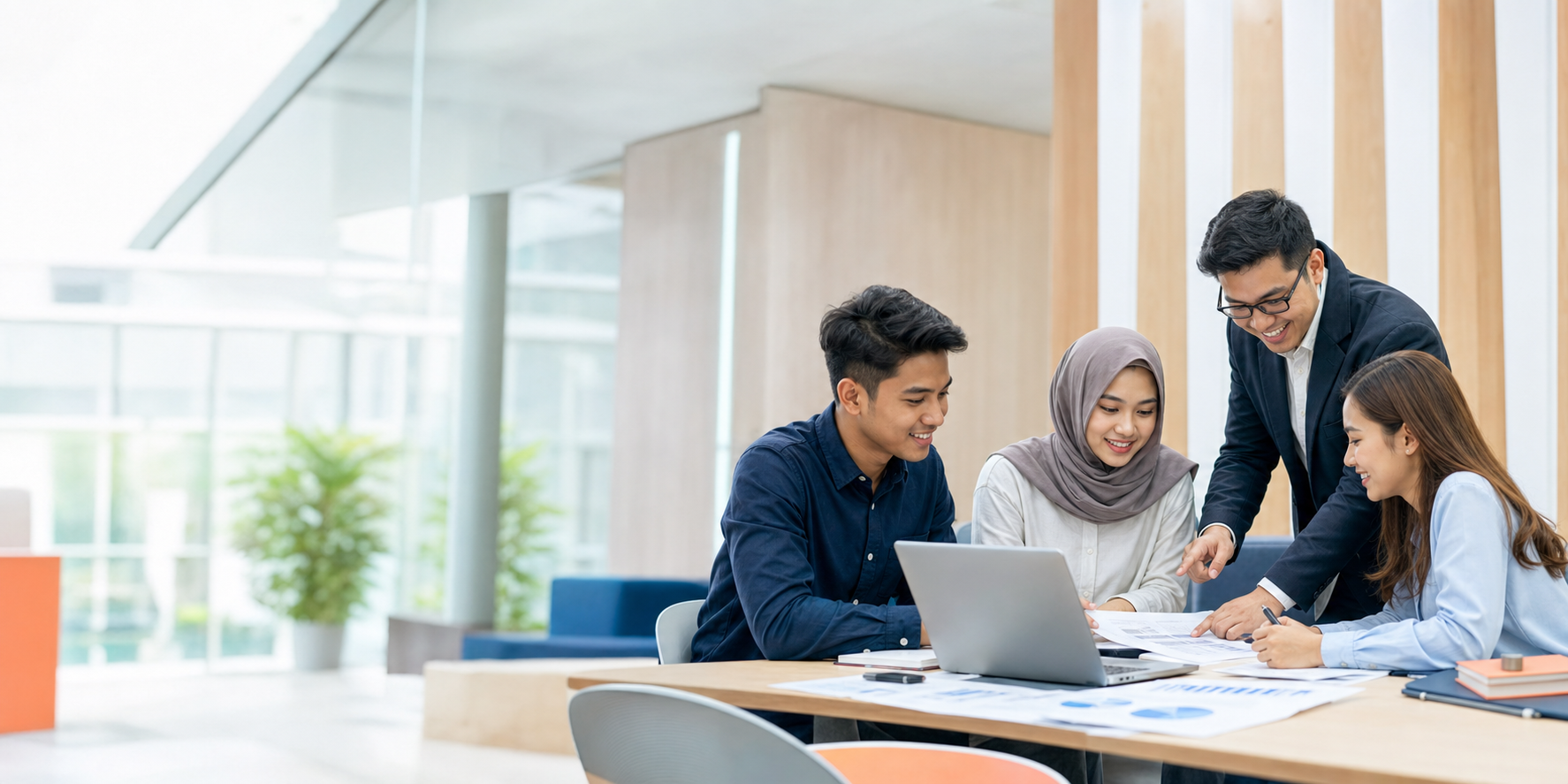 Students and lecturer reviewing accounting materials in a modern campus setting